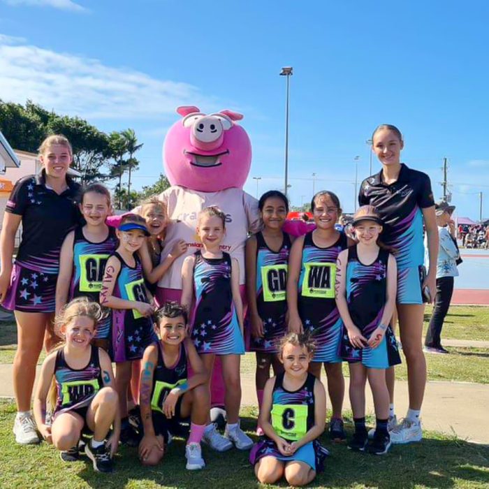 Galaxy Netball Club Junior Team Photo with pig mascot